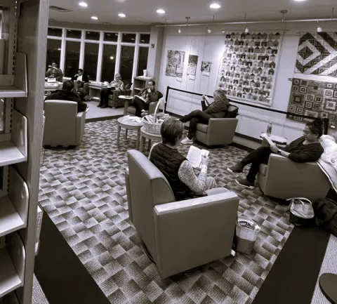 photograph of a Silent Book Club meeting at the library
