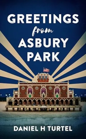 The cover of Greetings from Asbury Park shows an image of the Carousel building in Asbury Park.