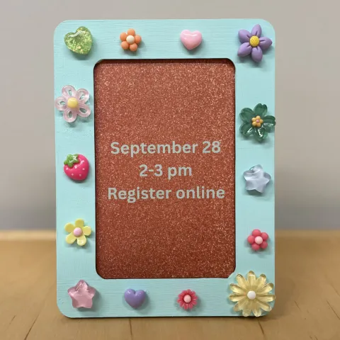 picture frame decorated with charms