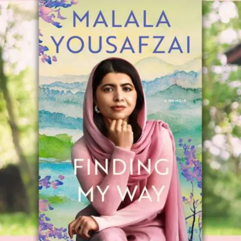 An image of Malala Yousafzai on the cover of her new book wearing a pink sweater and pink head scarf.