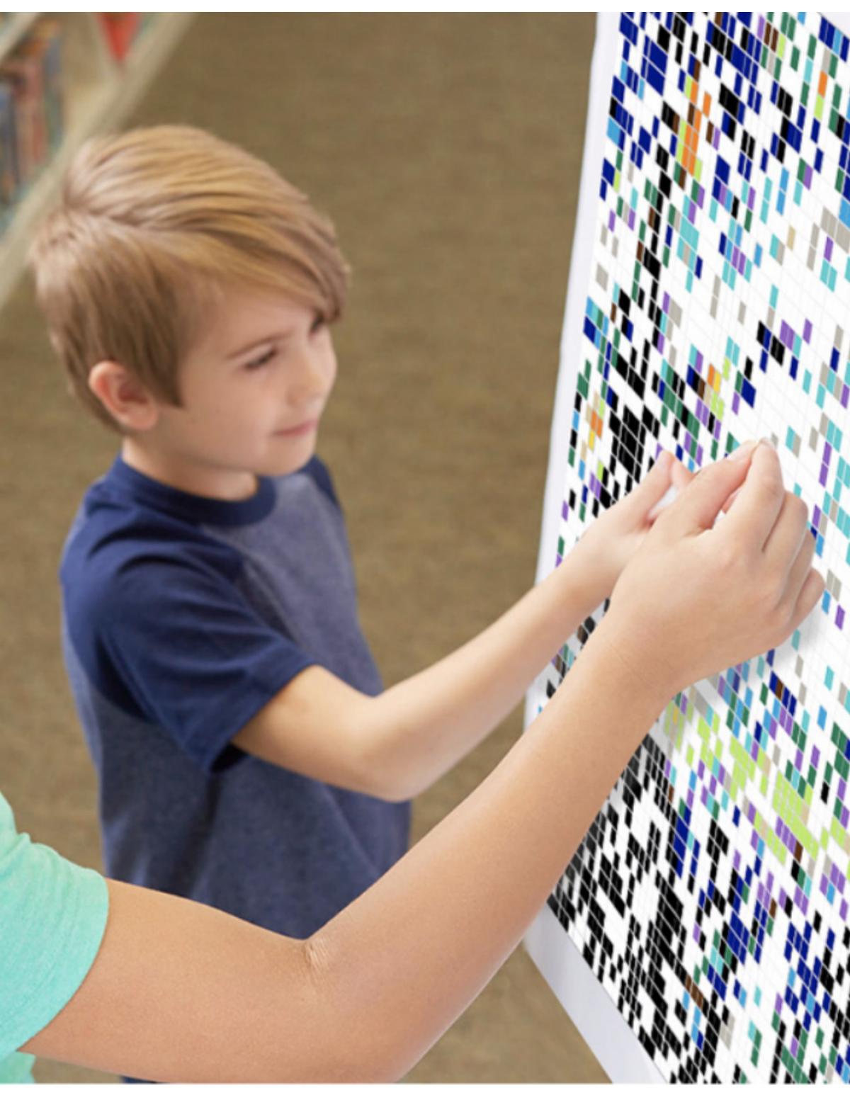 photo of child placing stickers on a mosaic art project